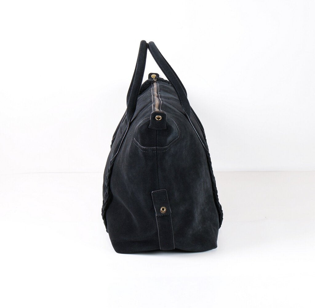 Black suede tote with two small top handles and braided detail on bag