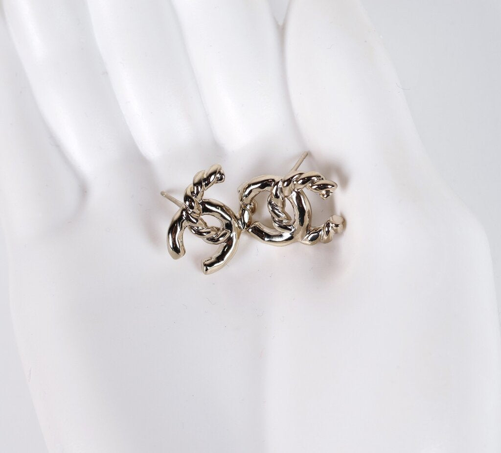 L25 C Gold Tone Twisted Logo Stud Earrings